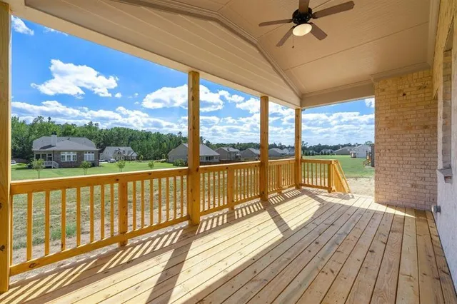 a view of a balcony with wooden floor