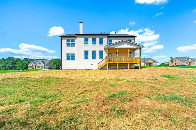 a large swimming pool with an outdoor seating