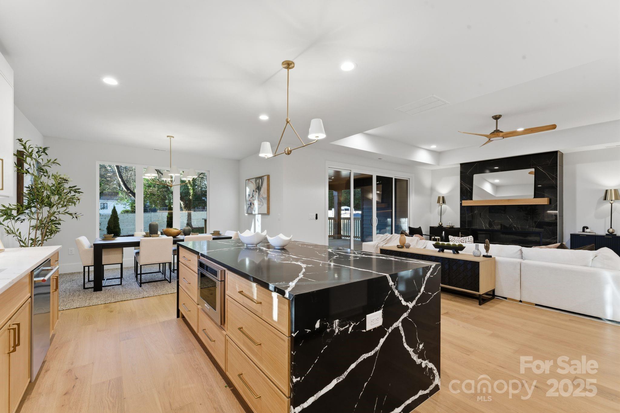4658 Murrayhill Road Charlotte, NC 28209 - Photo 12 of 48 a living room with stainless steel appliances granite countertop a kitchen island a stove and a view of living room