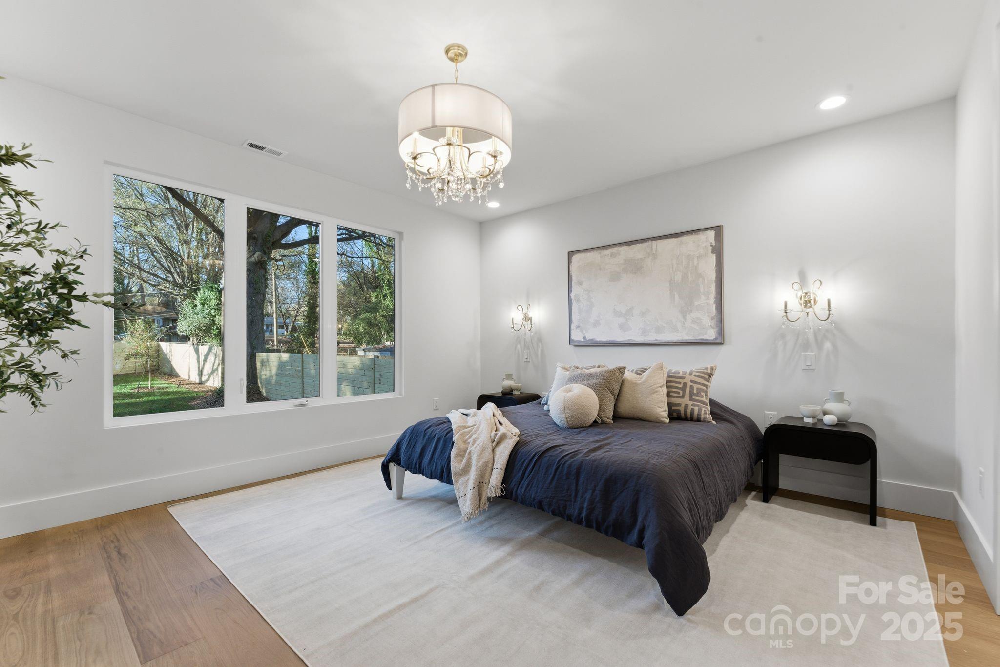 4658 Murrayhill Road Charlotte, NC 28209 - Photo 20 of 48 a living room with furniture chandelier and a large window