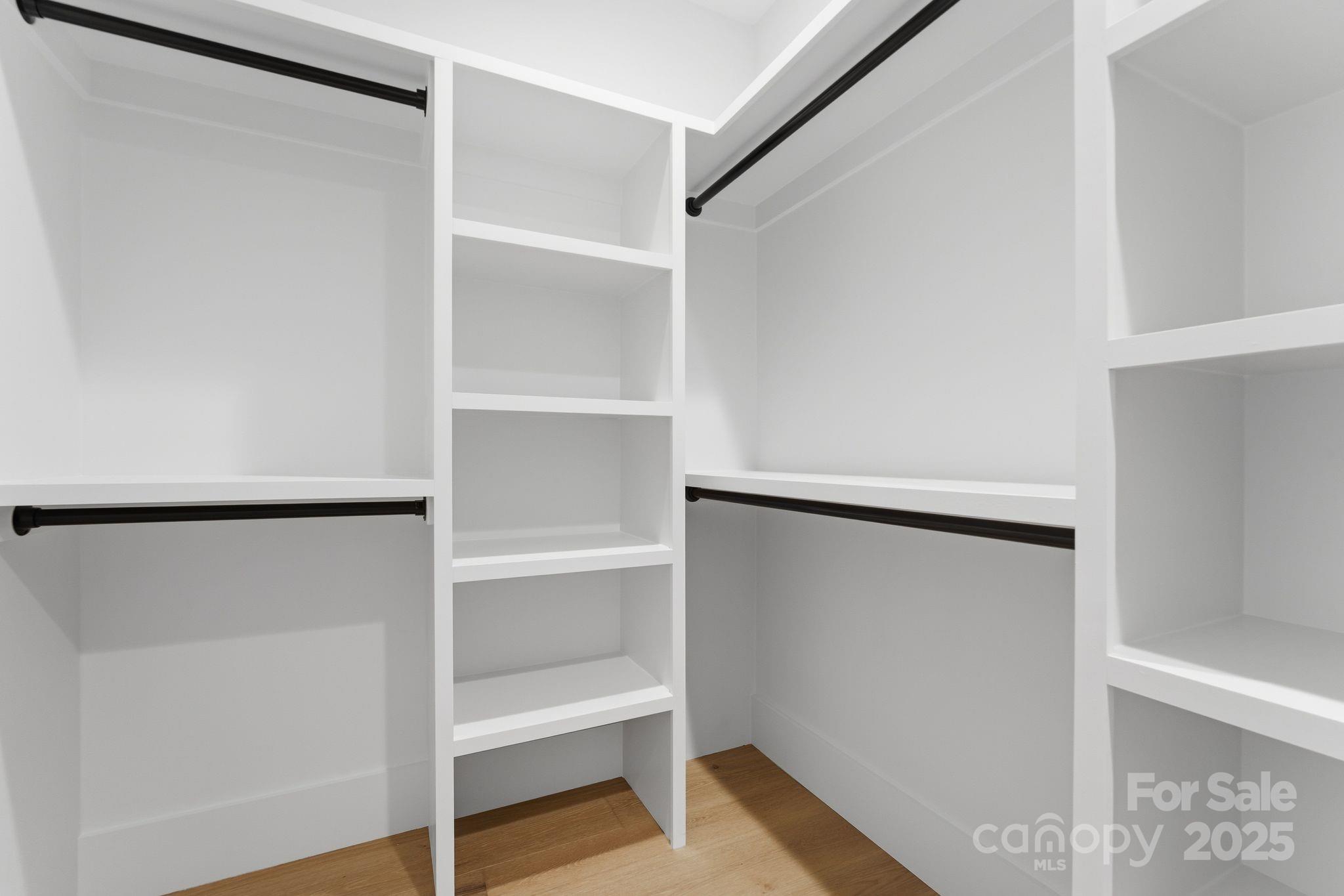 4658 Murrayhill Road Charlotte, NC 28209 - Photo 27 of 48 a view of walk in closet with empty racks