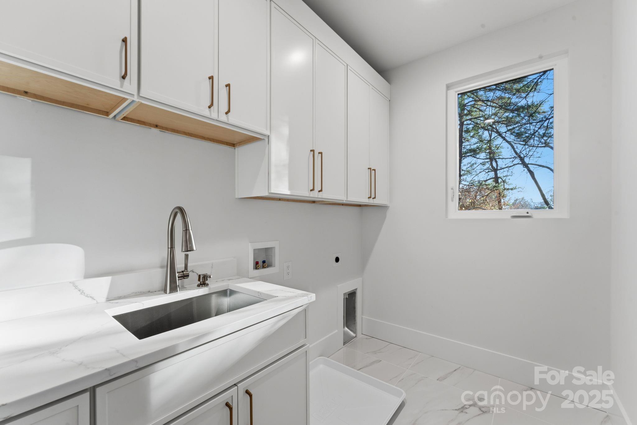 4658 Murrayhill Road Charlotte, NC 28209 - Photo 38 of 48 a view of a kitchen with sink and cabinets