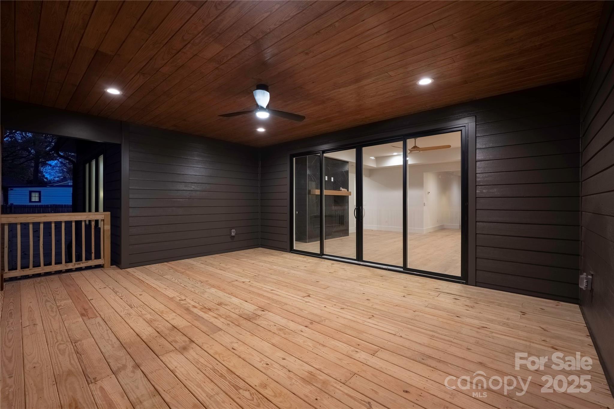 4658 Murrayhill Road Charlotte, NC 28209 - Photo 41 of 48 a view of an empty room with wooden floor and a window