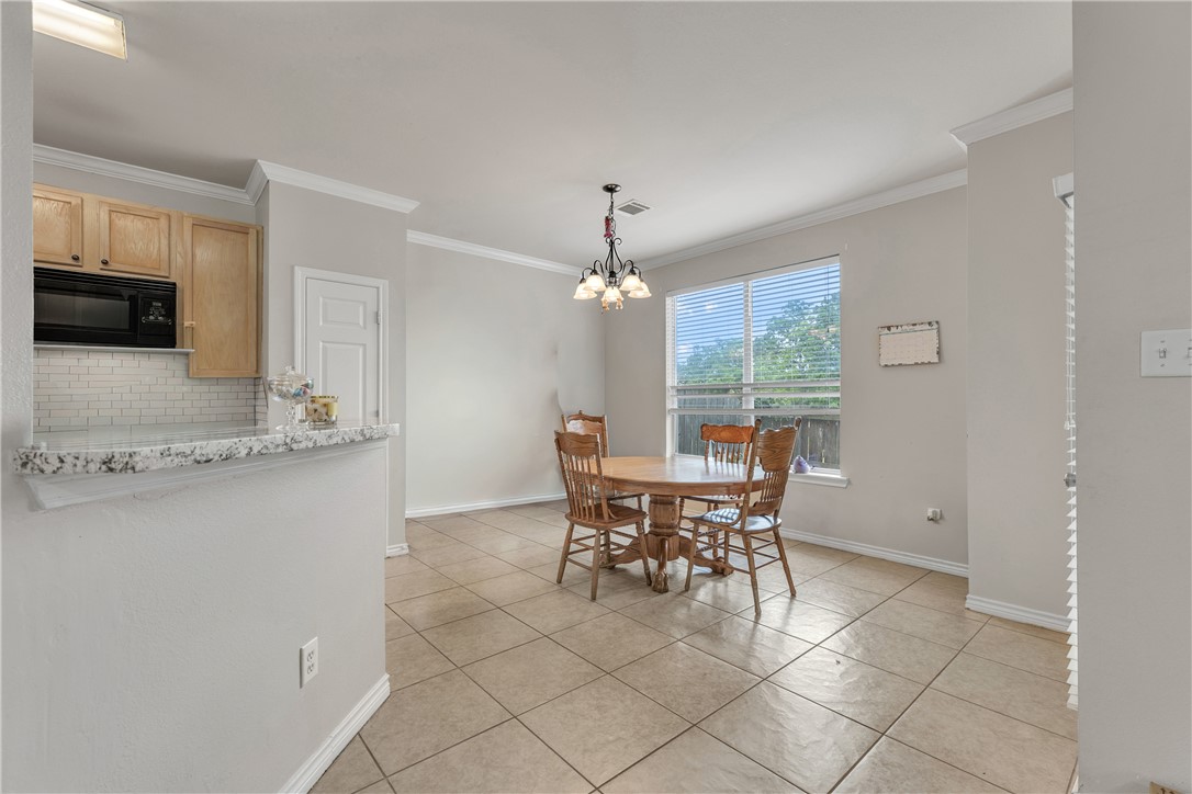 1425 West Villa Maria Road, Unit 1004 Bryan, TX 77801 - Photo 6 of 23 a dining room with furniture and window