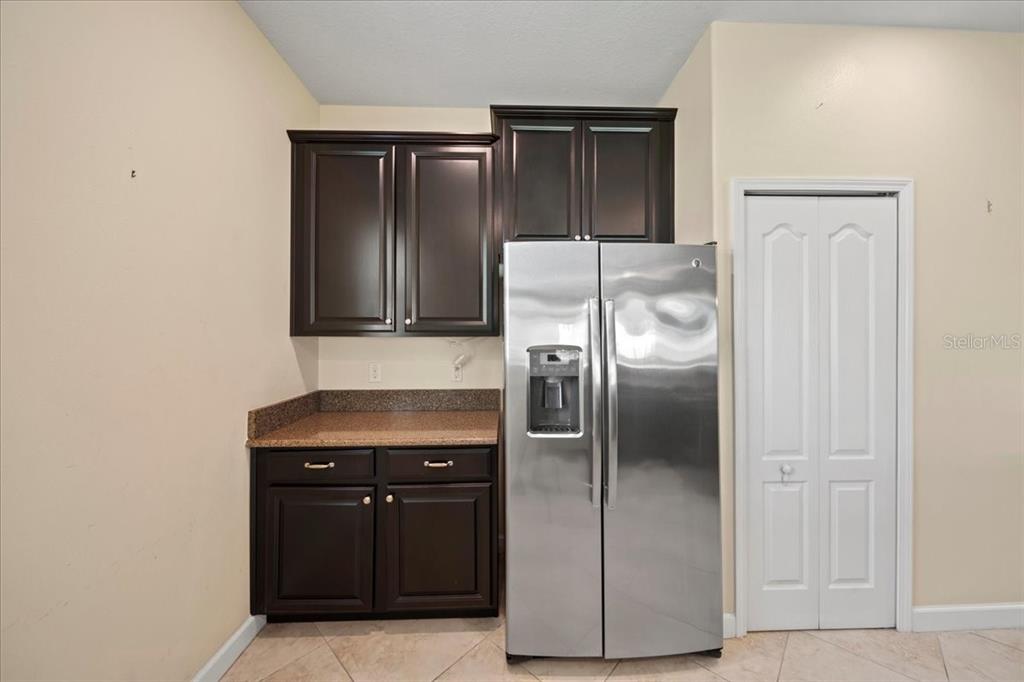 3565 Raleigh Drive Winter Haven, FL 33884 - Photo 15 of 73 a kitchen with metallic refrigerator freezer and a dishwasher