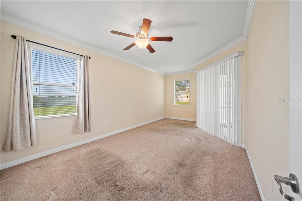 3565 Raleigh Drive Winter Haven, FL 33884 - Photo 20 of 73 a view of a livingroom with a ceiling fan and window