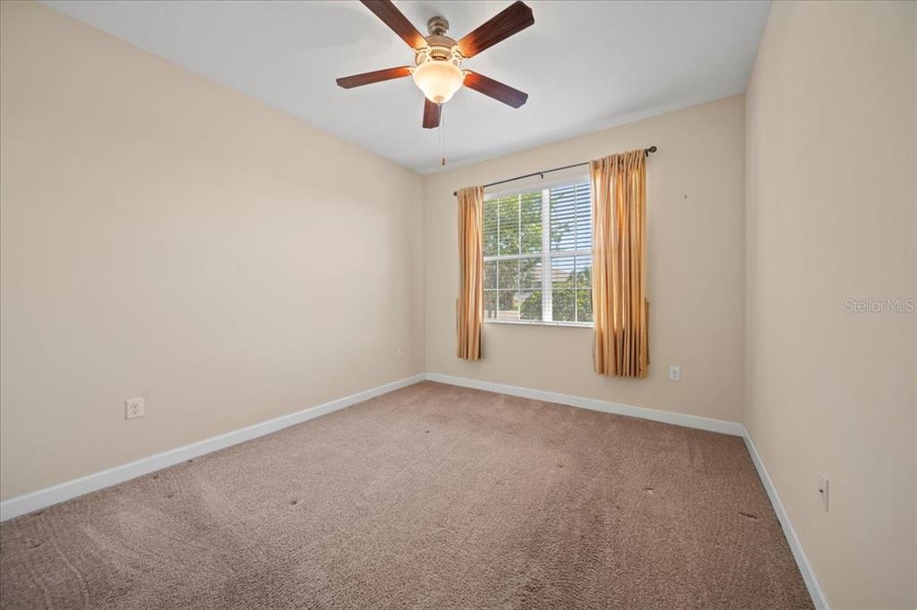 3565 Raleigh Drive Winter Haven, FL 33884 - Photo 31 of 73 an empty room with windows and fan