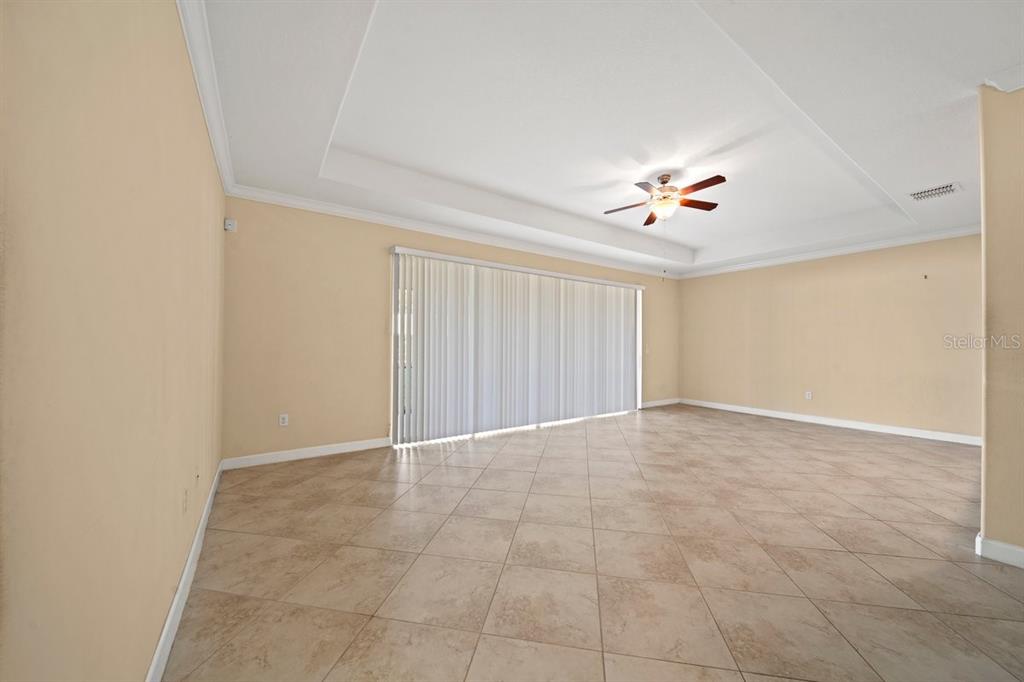3565 Raleigh Drive Winter Haven, FL 33884 - Photo 9 of 73 an empty room with a ceiling fan and a window