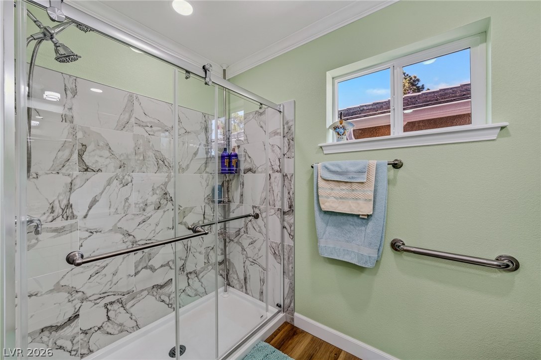3780 South Ranger Way Pahrump, NV 89048 - Photo 32 of 57 A well-appointed shower stall features elegant marble-look tiling and convenient grab bars.