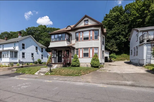 a front view of a house with a yard