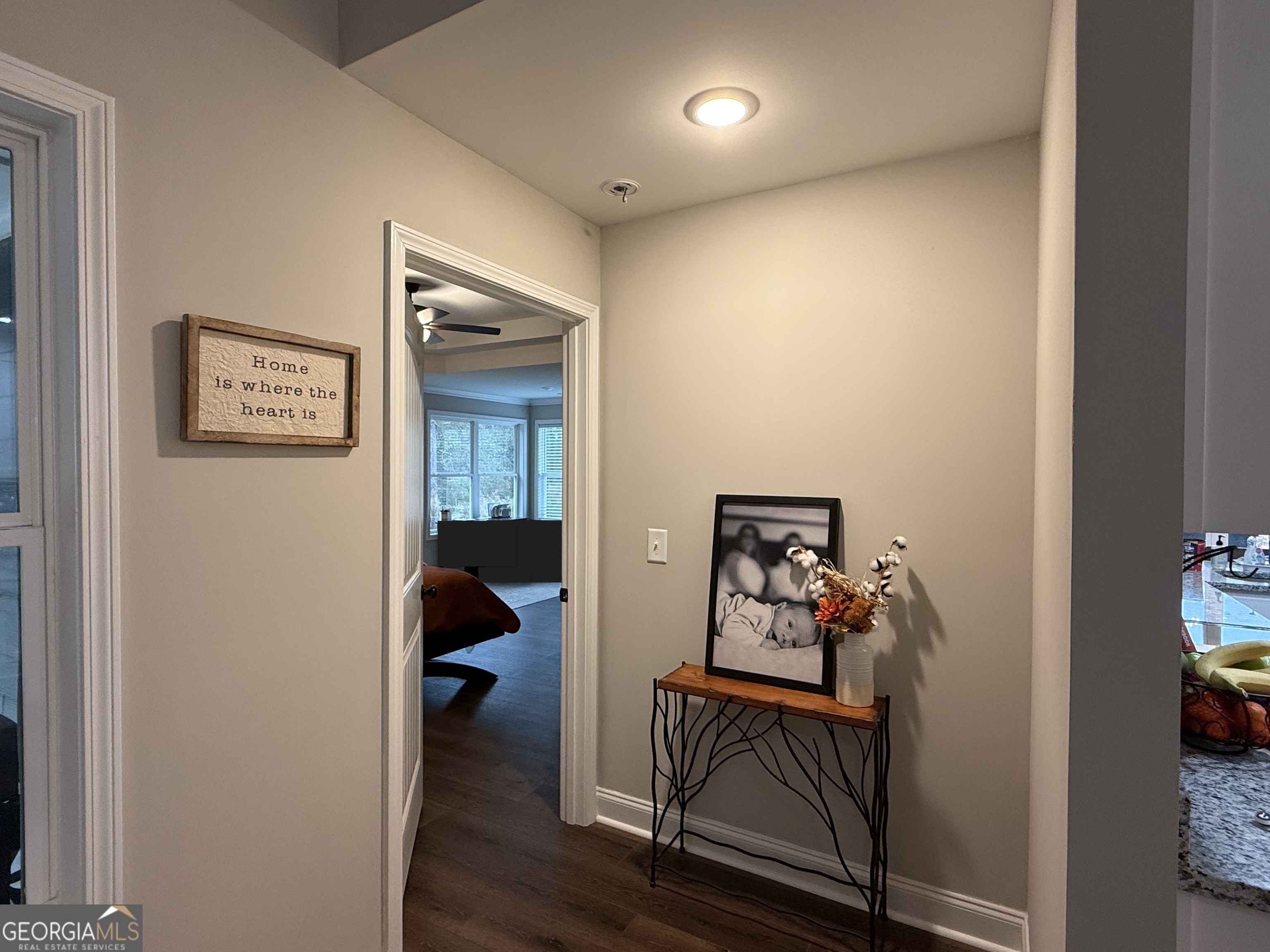 712 Scott Mill Road Hartwell, GA 30643 - Photo 15 of 31 a view of a hallway with workspace and bedroom with furniture