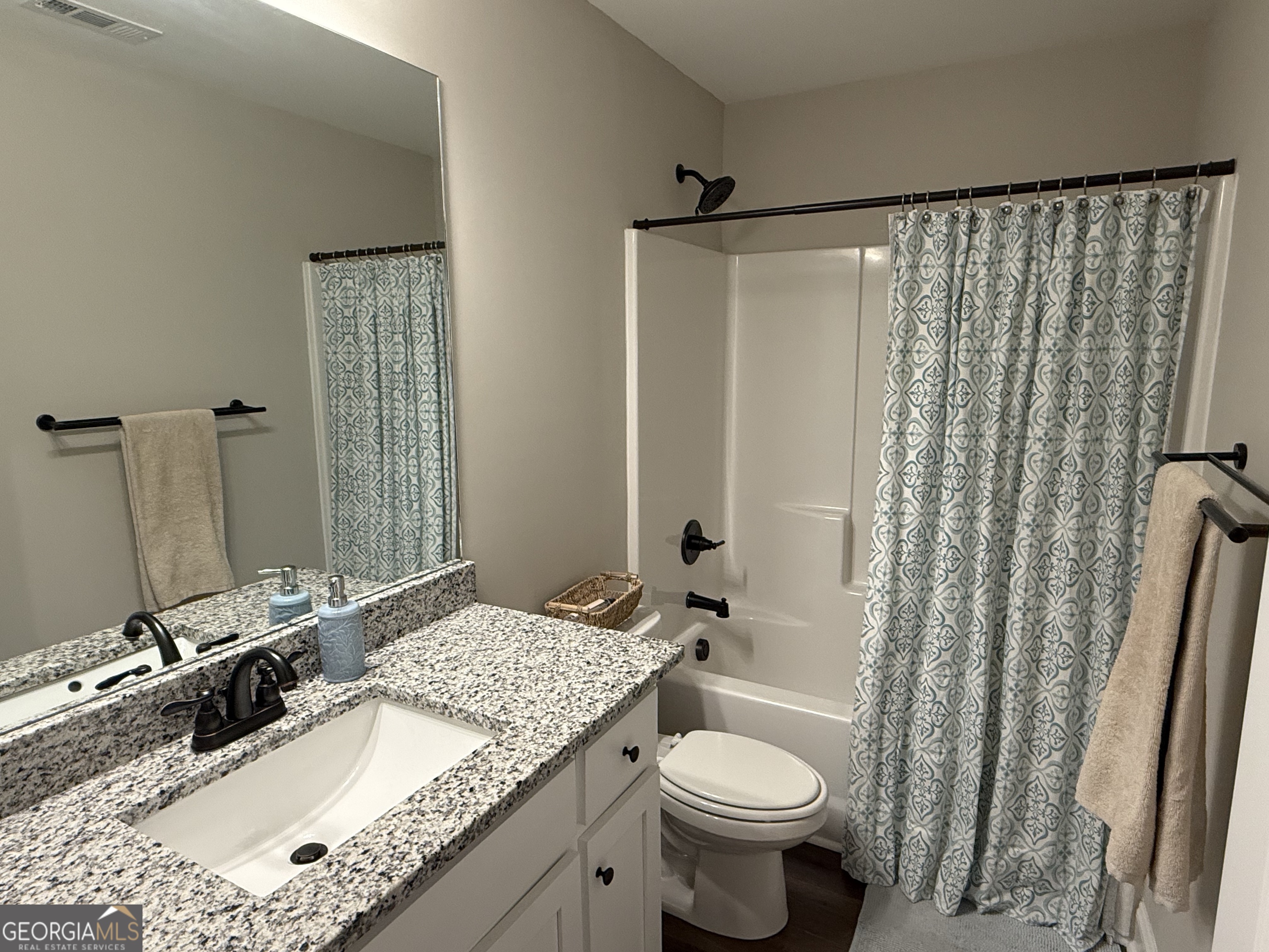 712 Scott Mill Road Hartwell, GA 30643 - Photo 24 of 31 a bathroom with a granite countertop sink and a mirror