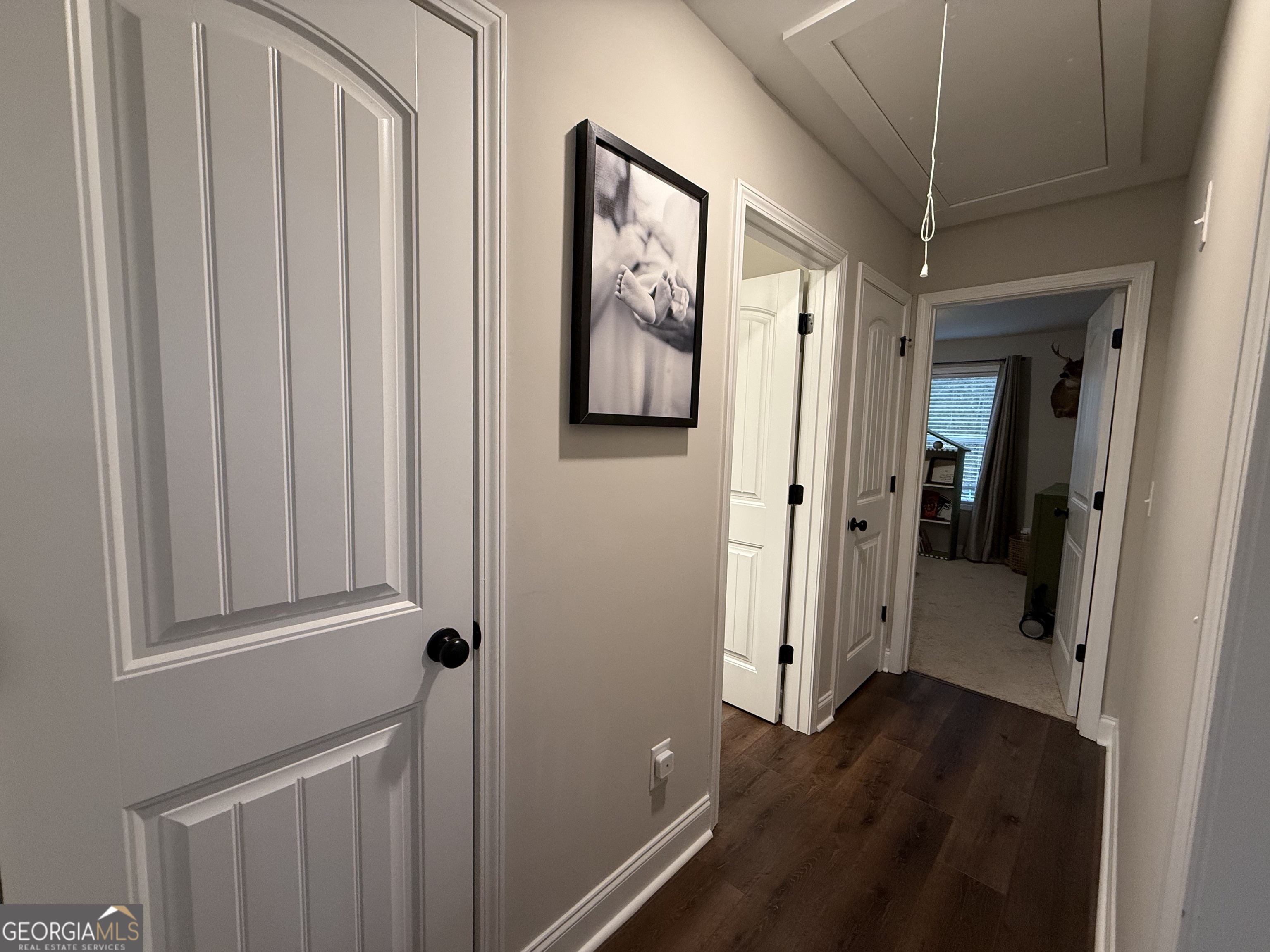 712 Scott Mill Road Hartwell, GA 30643 - Photo 3 of 31 a view of a hallway with wooden floor and staircase