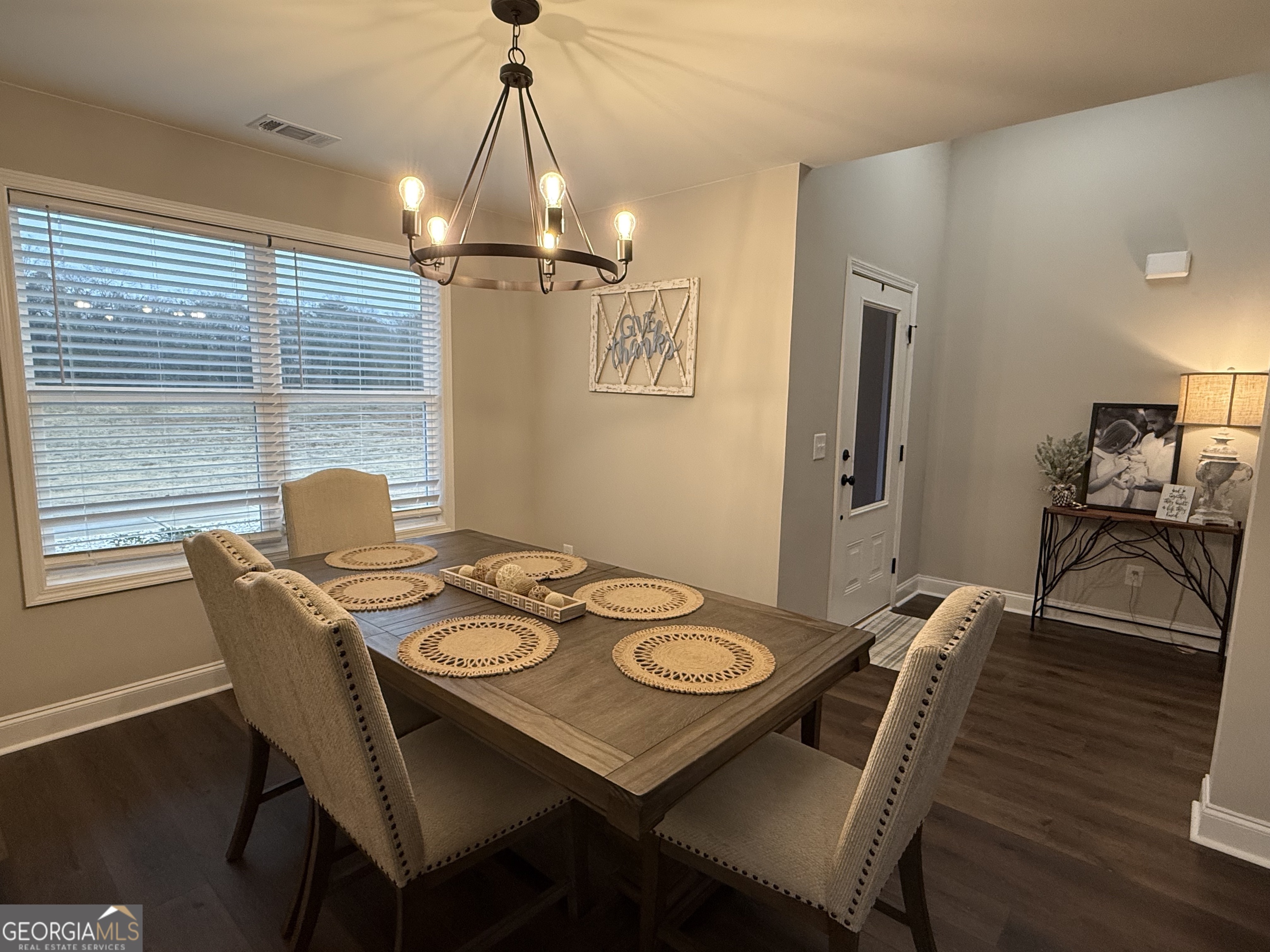 712 Scott Mill Road Hartwell, GA 30643 - Photo 5 of 31 a view of a dining room with furniture wooden floor and chandelier