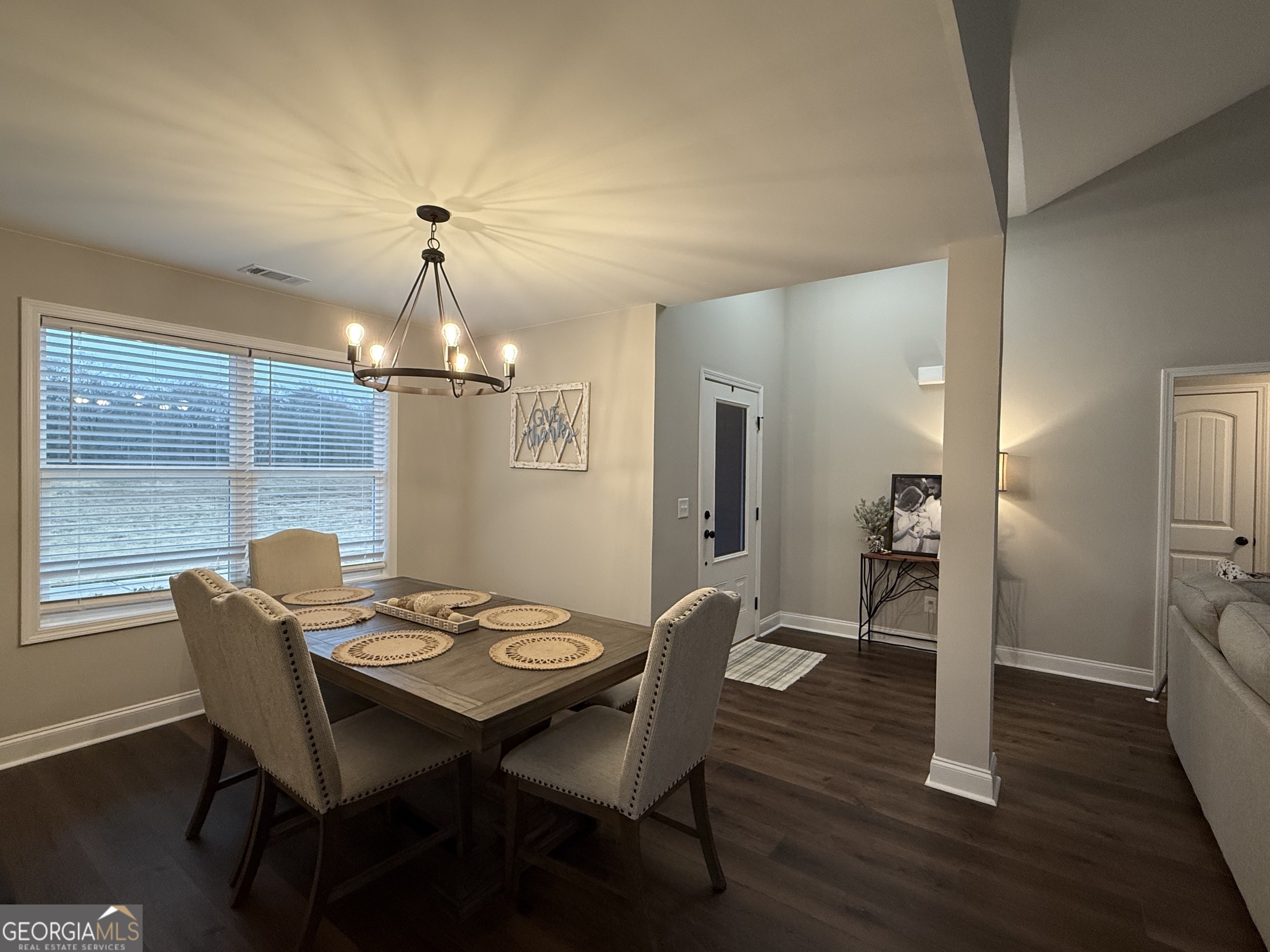 712 Scott Mill Road Hartwell, GA 30643 - Photo 6 of 31 a view of a dining room with furniture and wooden floor