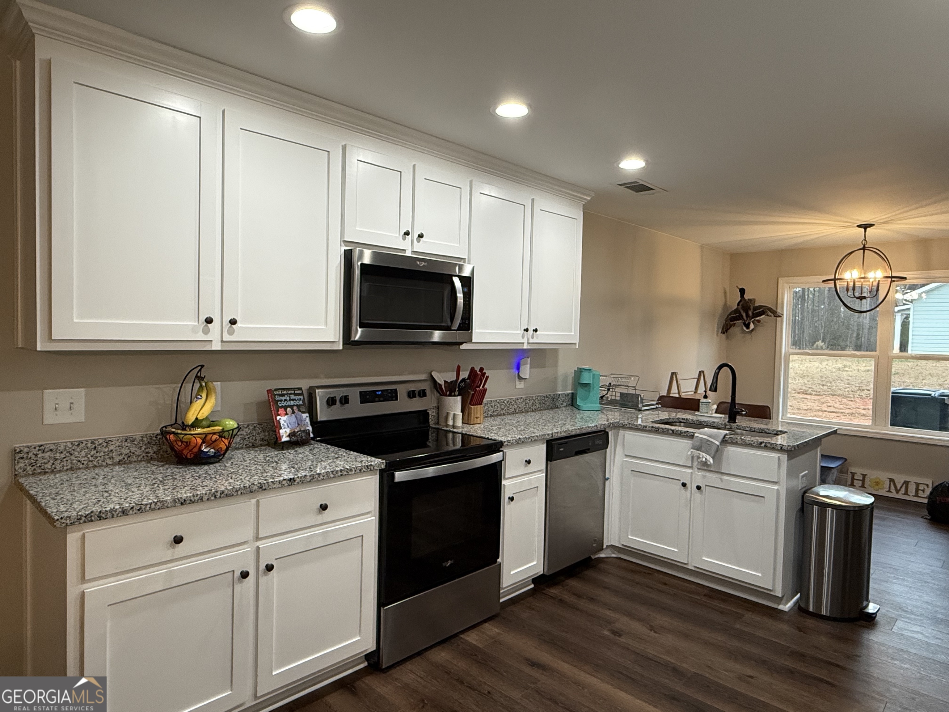 712 Scott Mill Road Hartwell, GA 30643 - Photo 10 of 31 a kitchen with sink a microwave and cabinets