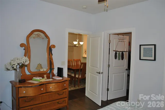 a view of hall way with mirror