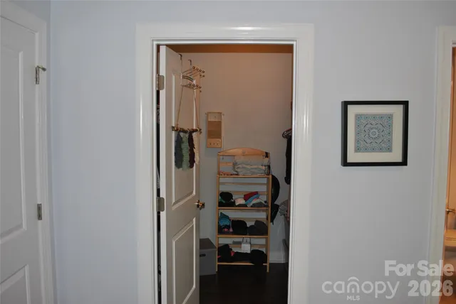 a view of a hallway with closet
