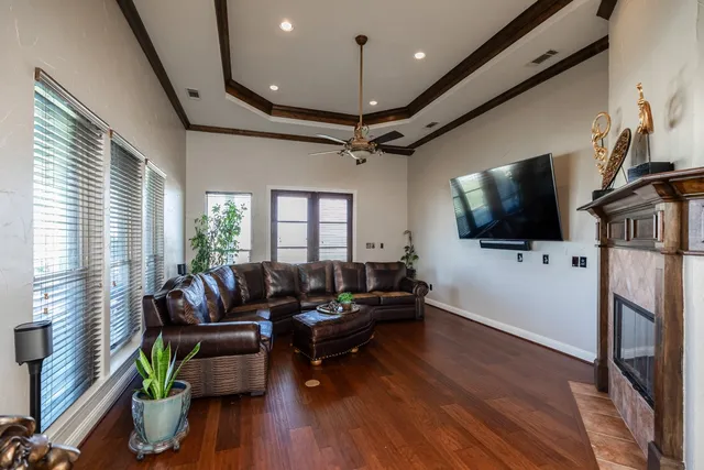 a bathroom with a granite countertop sink and a toilet