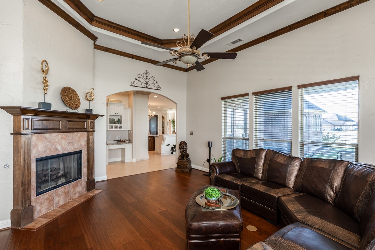 10940 Sheila Lane Beaumont, TX 77705 - Photo 20 of 50 a living room with furniture a fireplace and wooden floor
