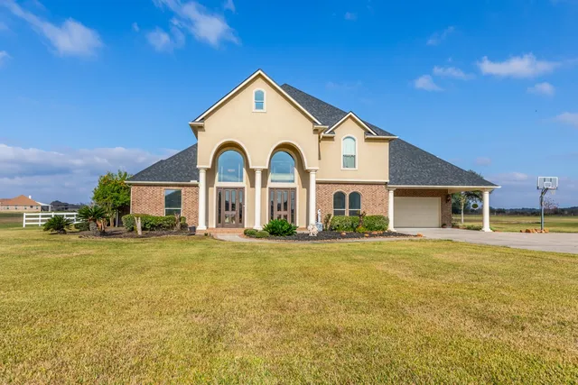 a view of a brick house with a large windows