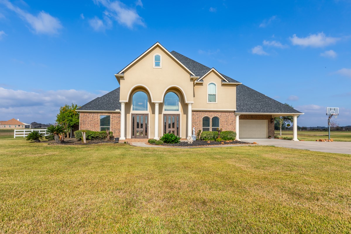 10940 Sheila Lane Beaumont, TX 77705 - Photo 2 of 50 a front view of a house with a yard