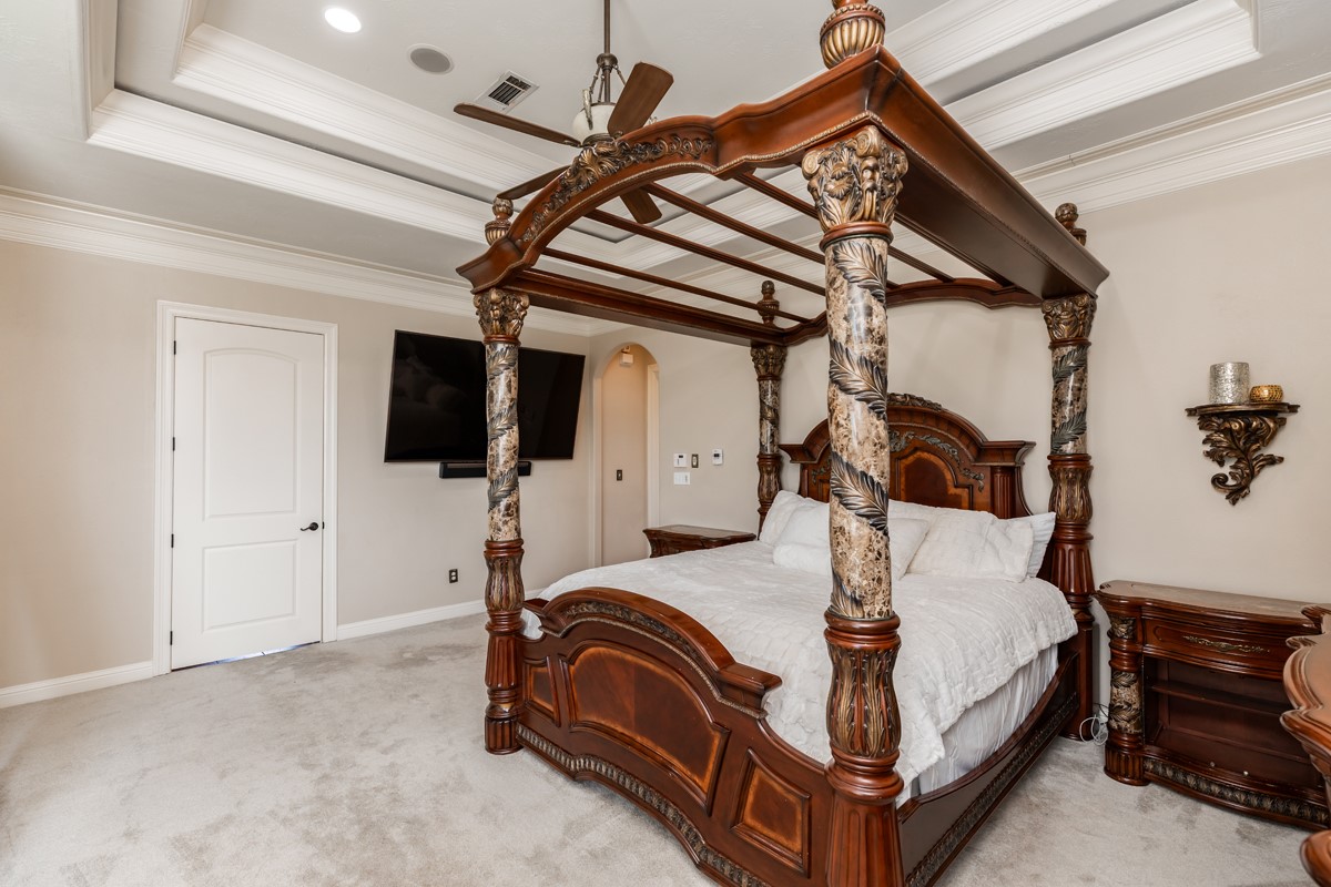 10940 Sheila Lane Beaumont, TX 77705 - Photo 27 of 50 a bedroom with a bed and a tv on table