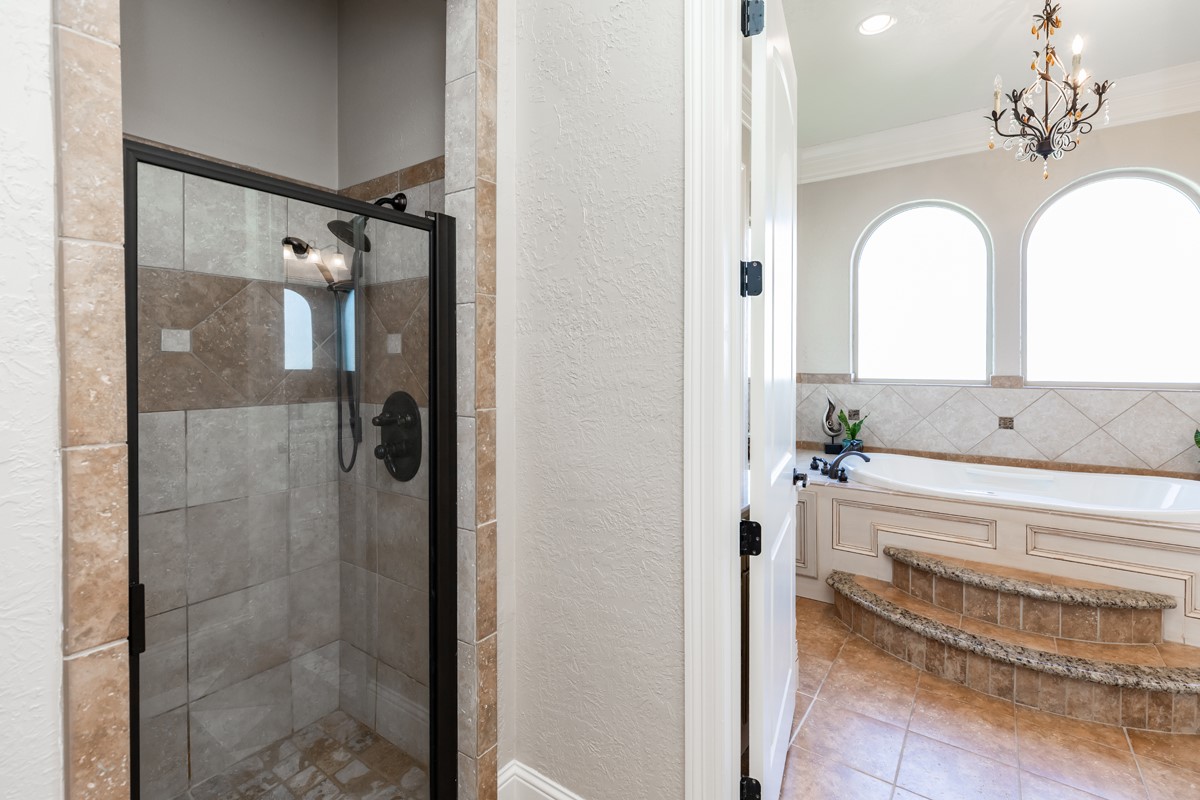 10940 Sheila Lane Beaumont, TX 77705 - Photo 30 of 50 a bathroom with a double vanity sink mirror and shower