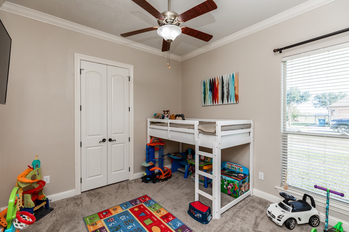 10940 Sheila Lane Beaumont, TX 77705 - Photo 33 of 50 a bedroom with furniture and a window