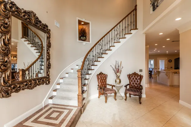 a kitchen with stainless steel appliances granite countertop a sink a oven and a granite counter tops