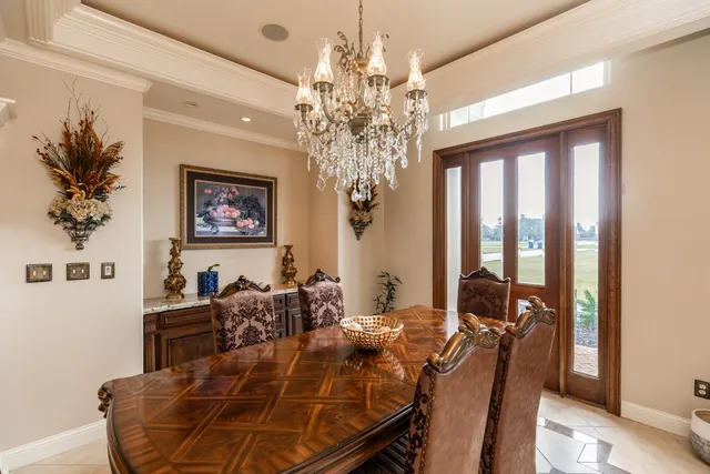 a bathroom with a granite countertop toilet sink and mirror