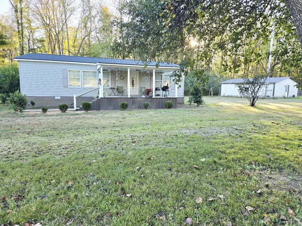 a house view with a garden space