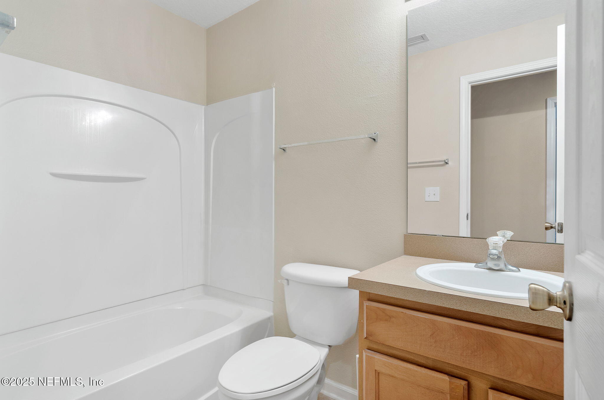 6700 Bowden Road, Unit 403 Jacksonville, FL 32216 - Photo 18 of 28 a bathroom with a sink toilet and shower