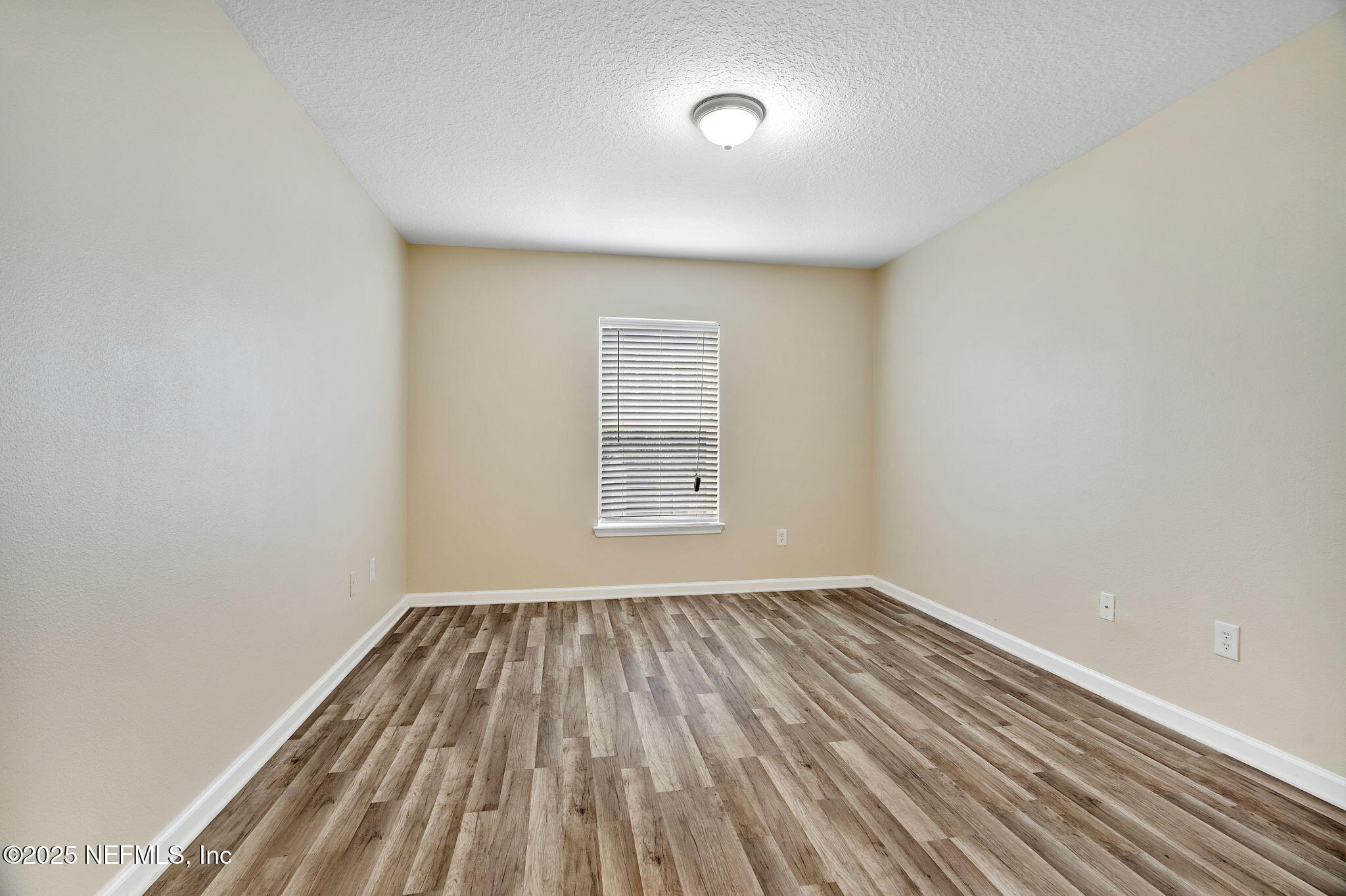 6700 Bowden Road, Unit 403 Jacksonville, FL 32216 - Photo 19 of 28 a view of a room with wooden floor and windows