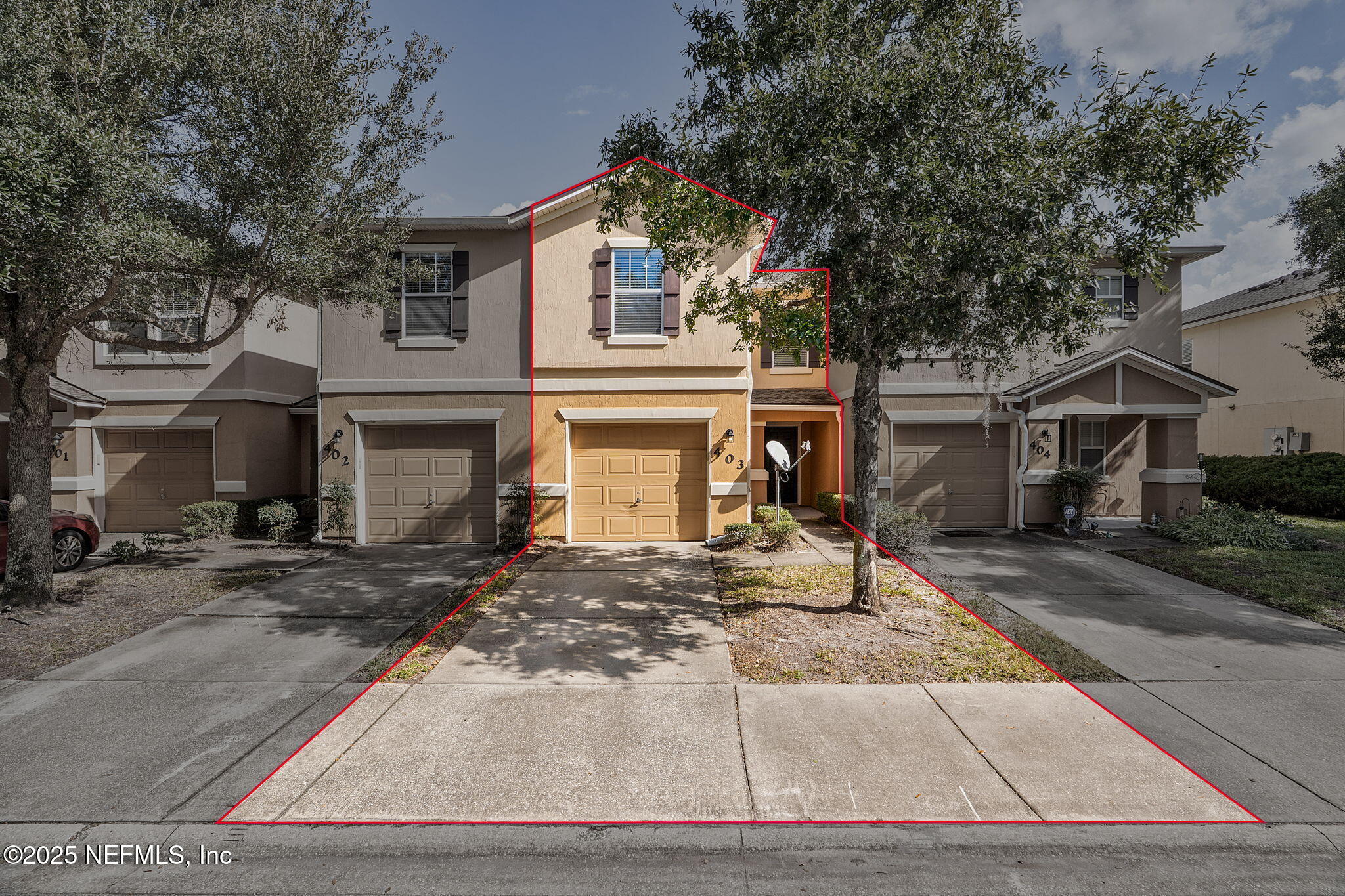 6700 Bowden Road, Unit 403 Jacksonville, FL 32216 - Photo 28 of 28 a view of a house with street that has a tree