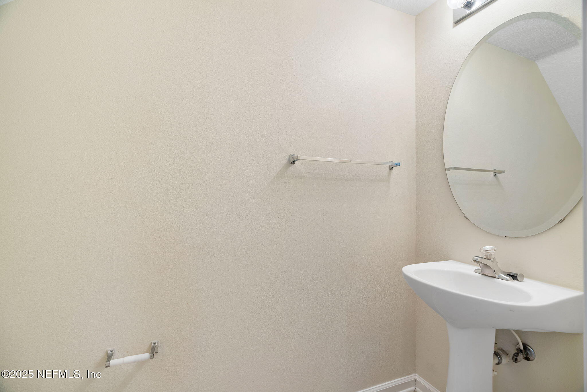6700 Bowden Road, Unit 403 Jacksonville, FL 32216 - Photo 5 of 28 a bathroom with a sink a mirror and vanity