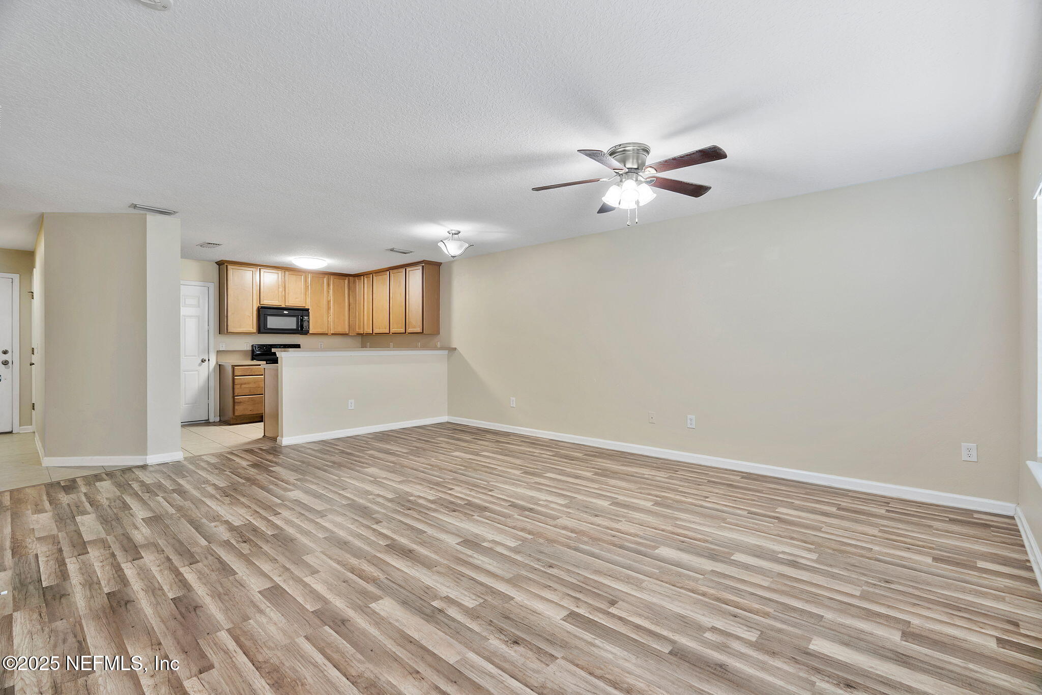 6700 Bowden Road, Unit 403 Jacksonville, FL 32216 - Photo 6 of 28 Living to kitchen