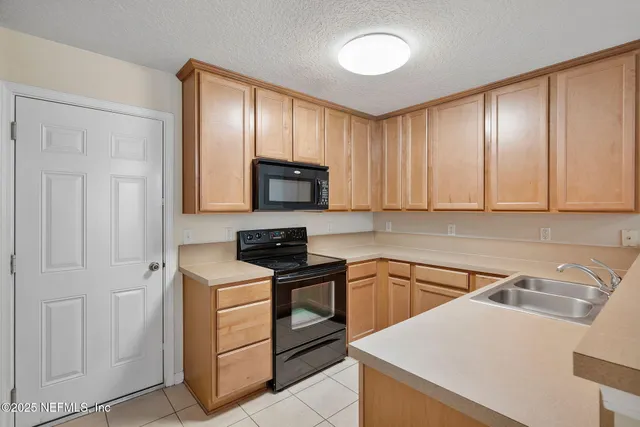 a view of a room with wooden floor and windows