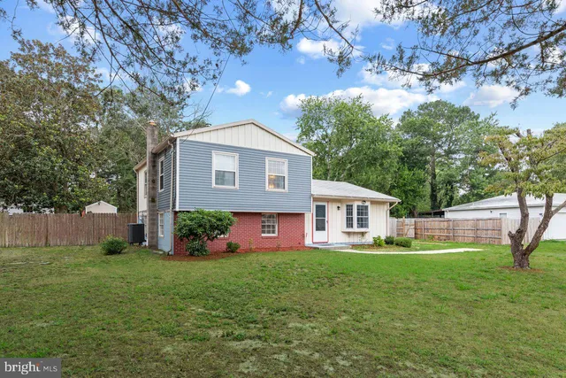 a front view of house with a garden