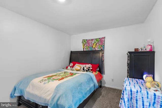 a bathroom with a toilet and a shower curtain