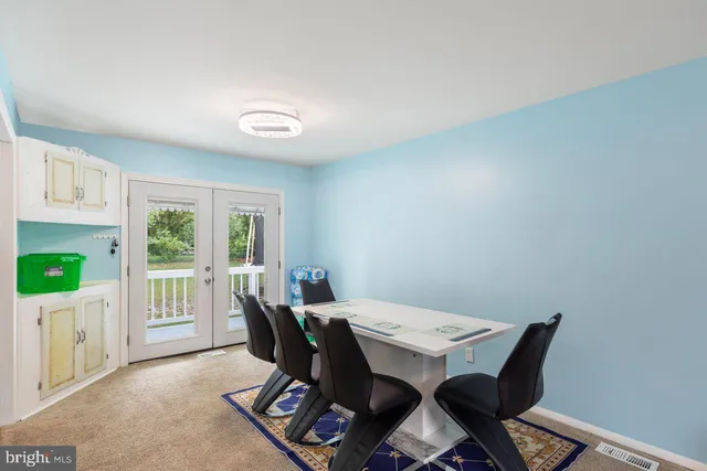 a living room with furniture a table and a window