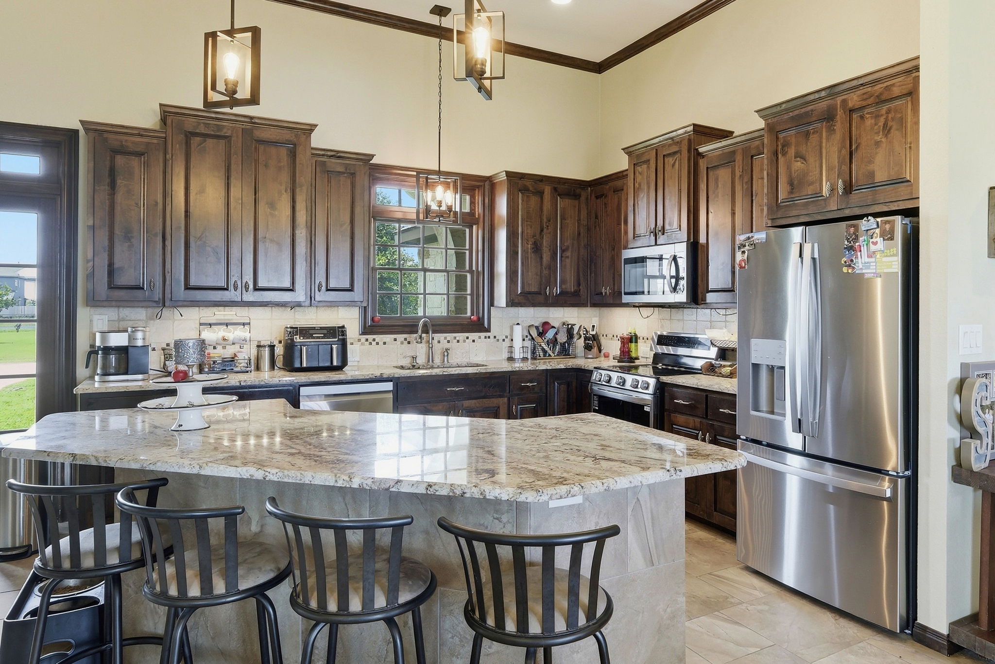 701 County Road 107 Georgetown, TX 78626 - Photo 13 of 30 a kitchen with granite countertop a counter space stainless steel appliances and cabinets