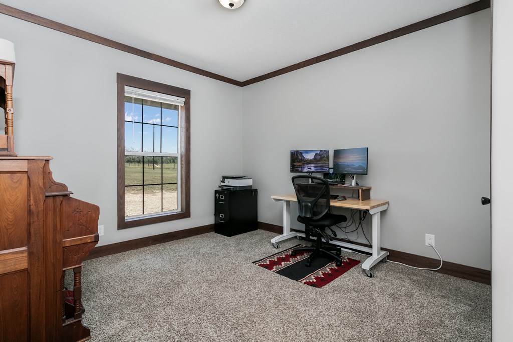 134 Concho Trail Harper, TX 78631 - Photo 17 of 31 a view of workspace with a window and shelf