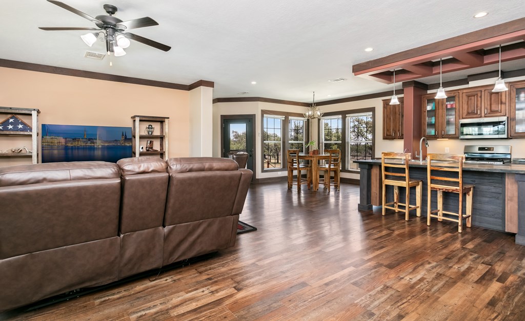 134 Concho Trail Harper, TX 78631 - Photo 19 of 31 a living room with furniture and a wooden floor