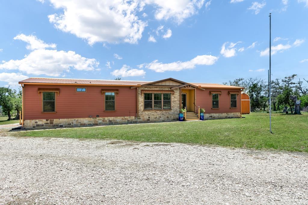 134 Concho Trail Harper, TX 78631 - Photo 2 of 31 a view of a house with a yard