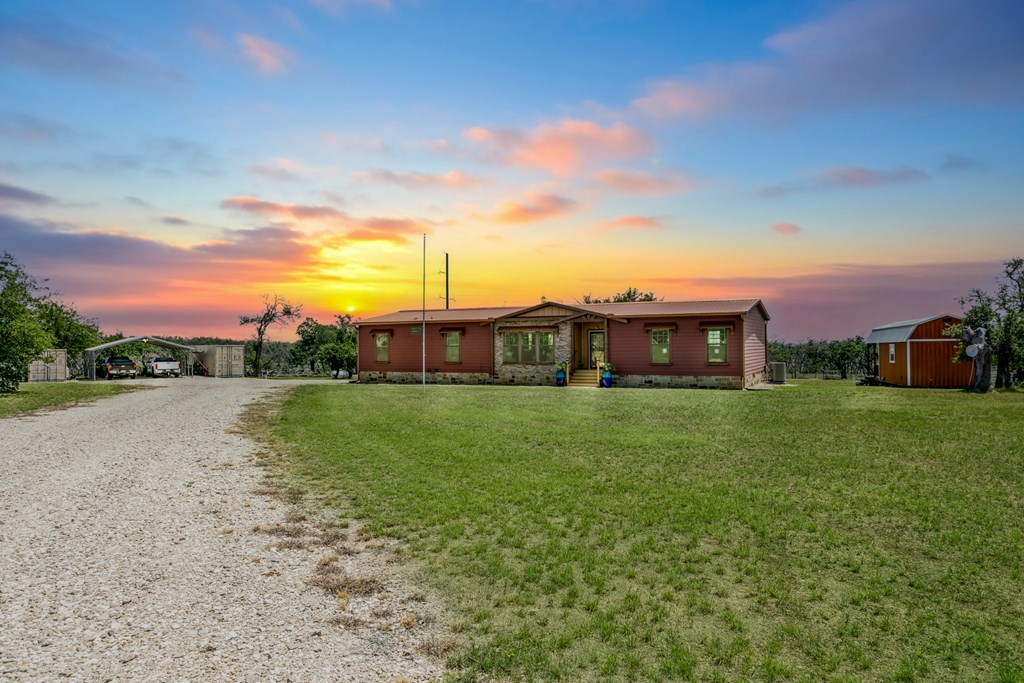 134 Concho Trail Harper, TX 78631 - Photo 29 of 31 a view of a big house with a big yard