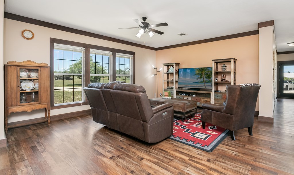 134 Concho Trail Harper, TX 78631 - Photo 8 of 31 a living room with furniture and a flat screen tv