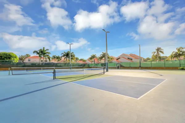 a view of an outdoor space and tennis court