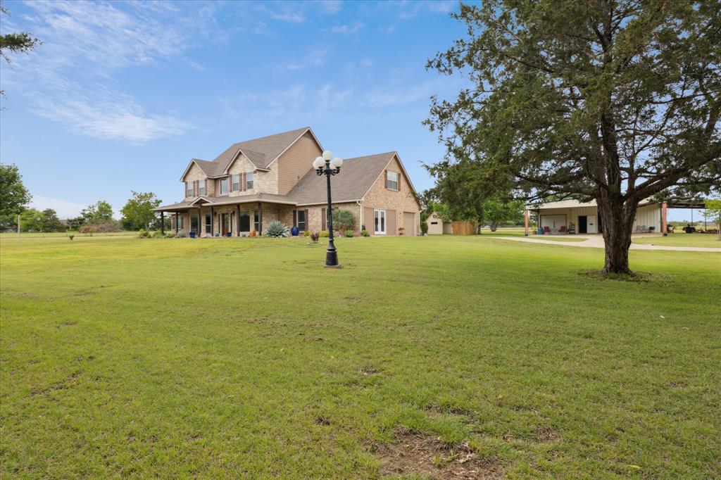6251 Hayes Road Midlothian, TX 76065 - Photo 23 of 30 a front view of a house with a big yard