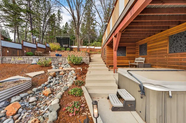 a view of a backyard with sitting area